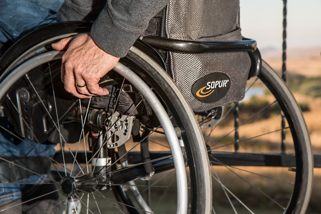 view of senior using a manual wheelchair