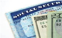 Image of a social security card, and the corner of two twenty dollar bills overlaying it
